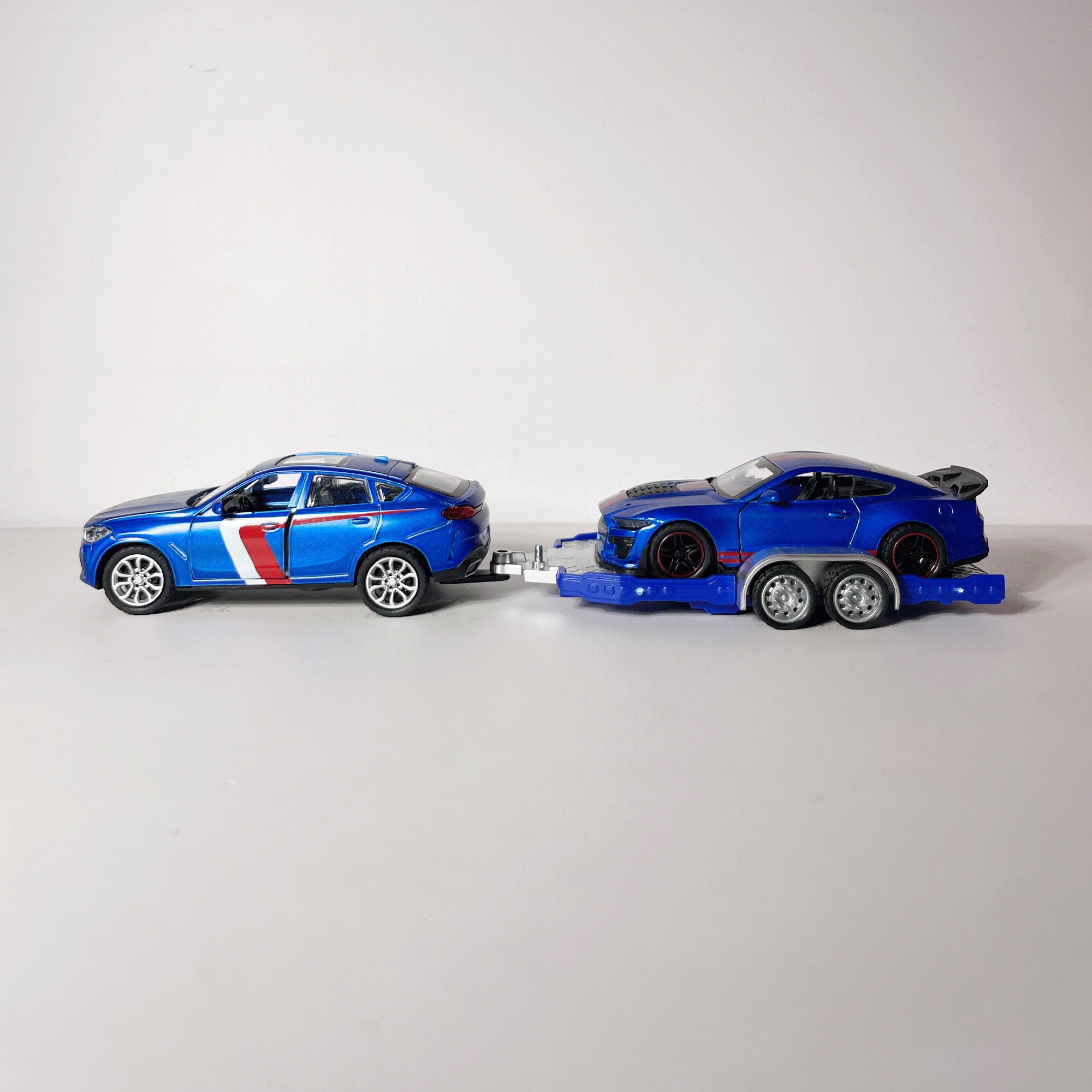 1:43 BMW X6 SUV with Sports Car Trailer Diecast Model Set