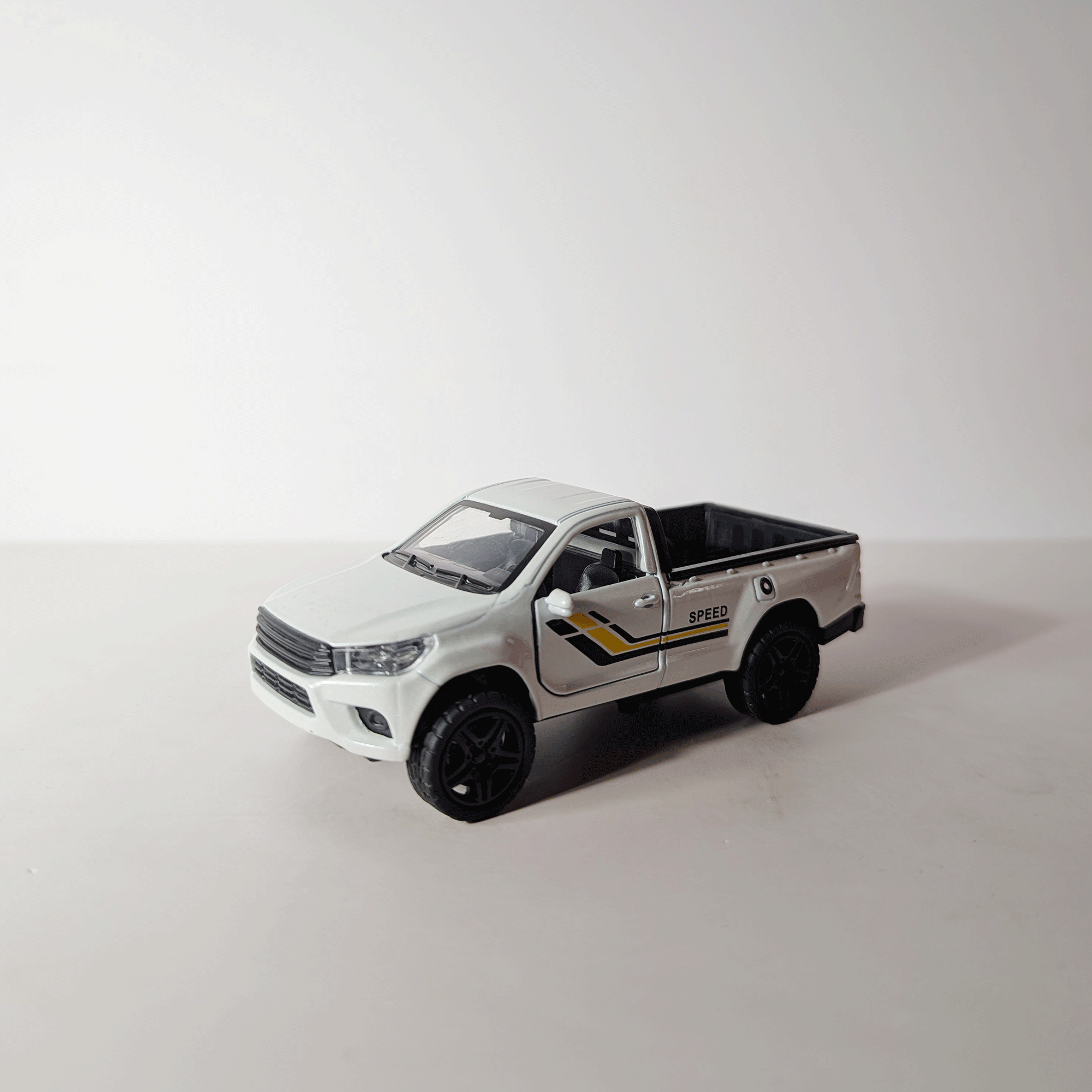 1:36 Hilux Old Model White