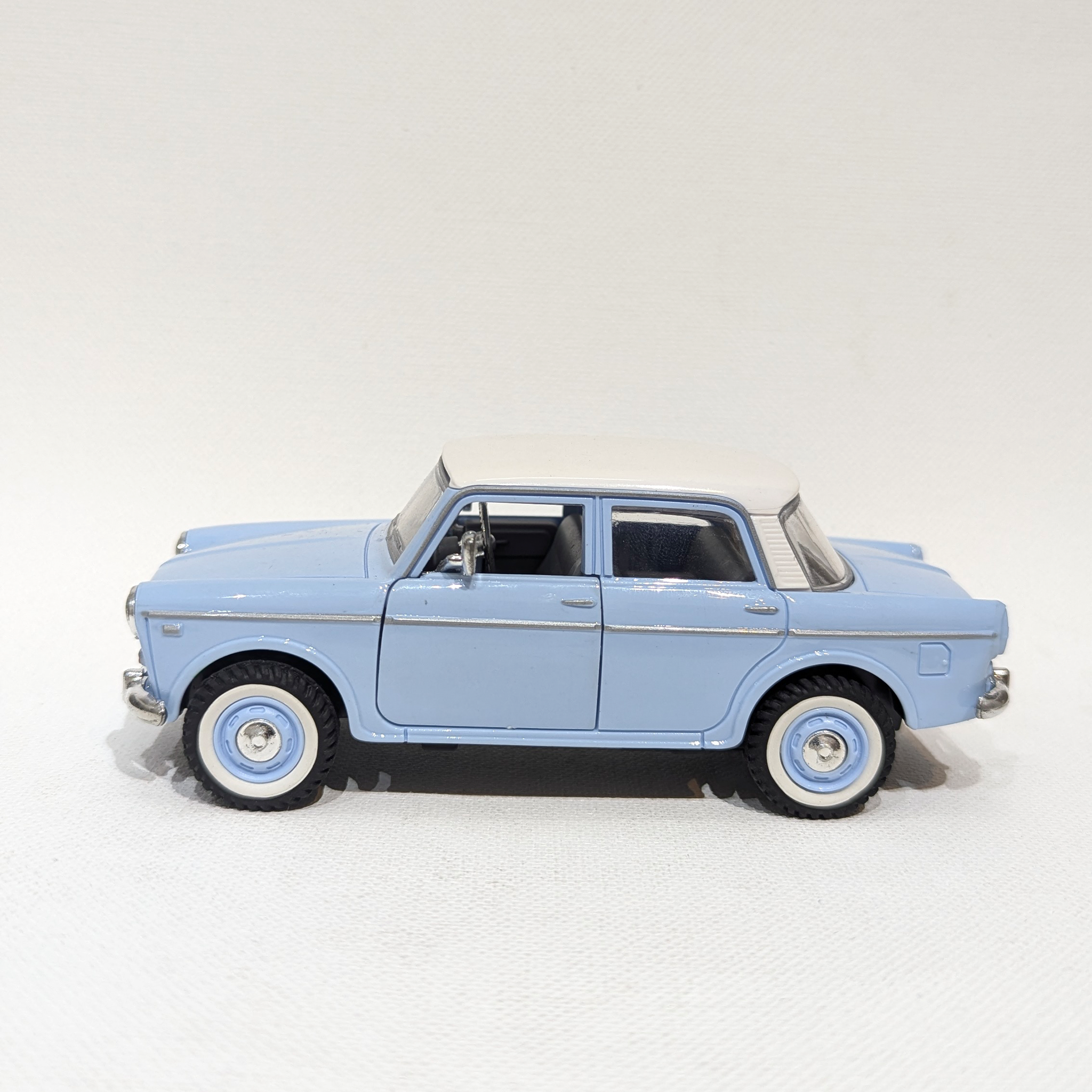 1:36 Classic Compact Sedan – Plastic Model with Rubber Tyres(Light Blue and White)