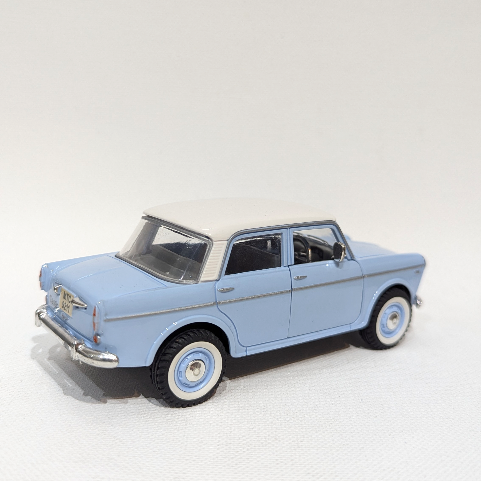 1:36 Classic Compact Sedan – Plastic Model with Rubber Tyres(Light Blue and White)