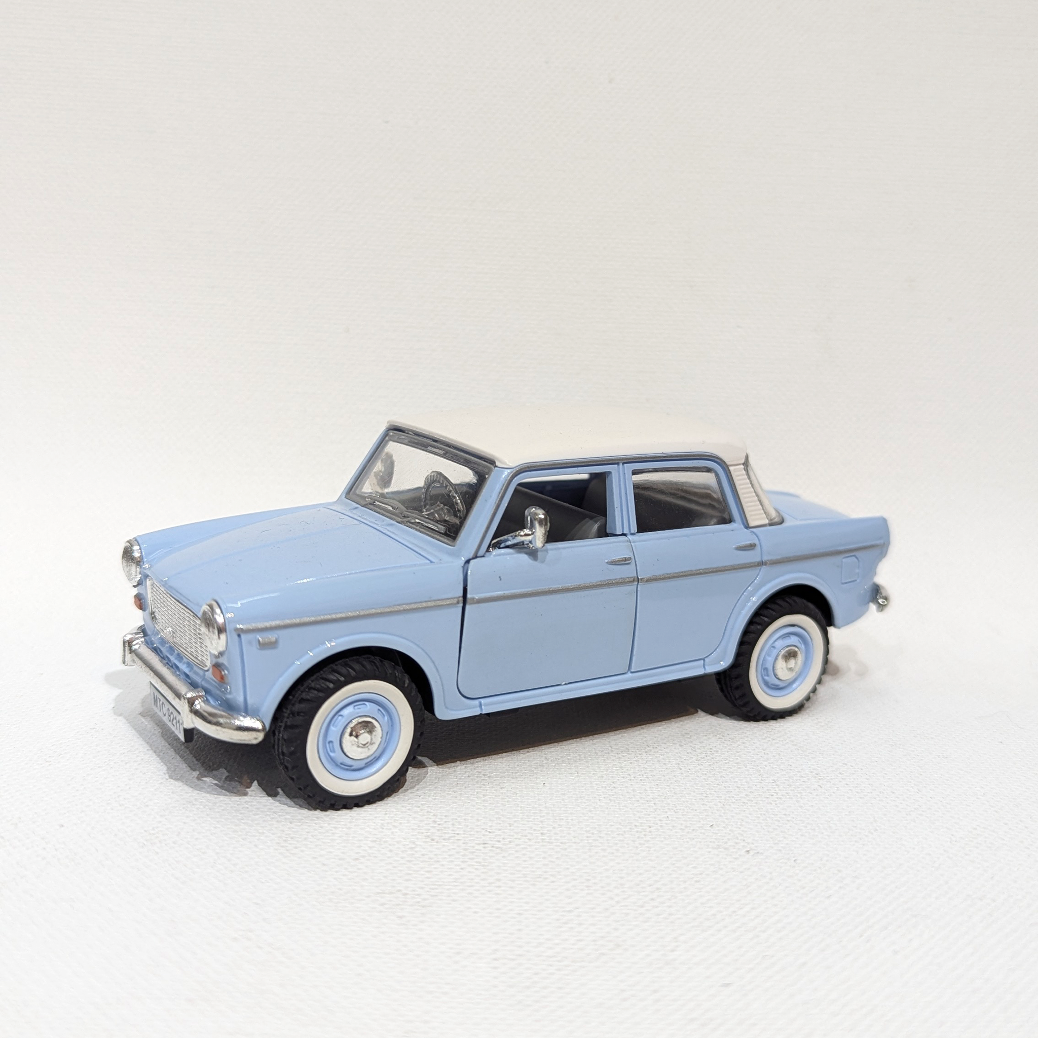 1:36 Classic Compact Sedan – Plastic Model with Rubber Tyres(Light Blue and White)